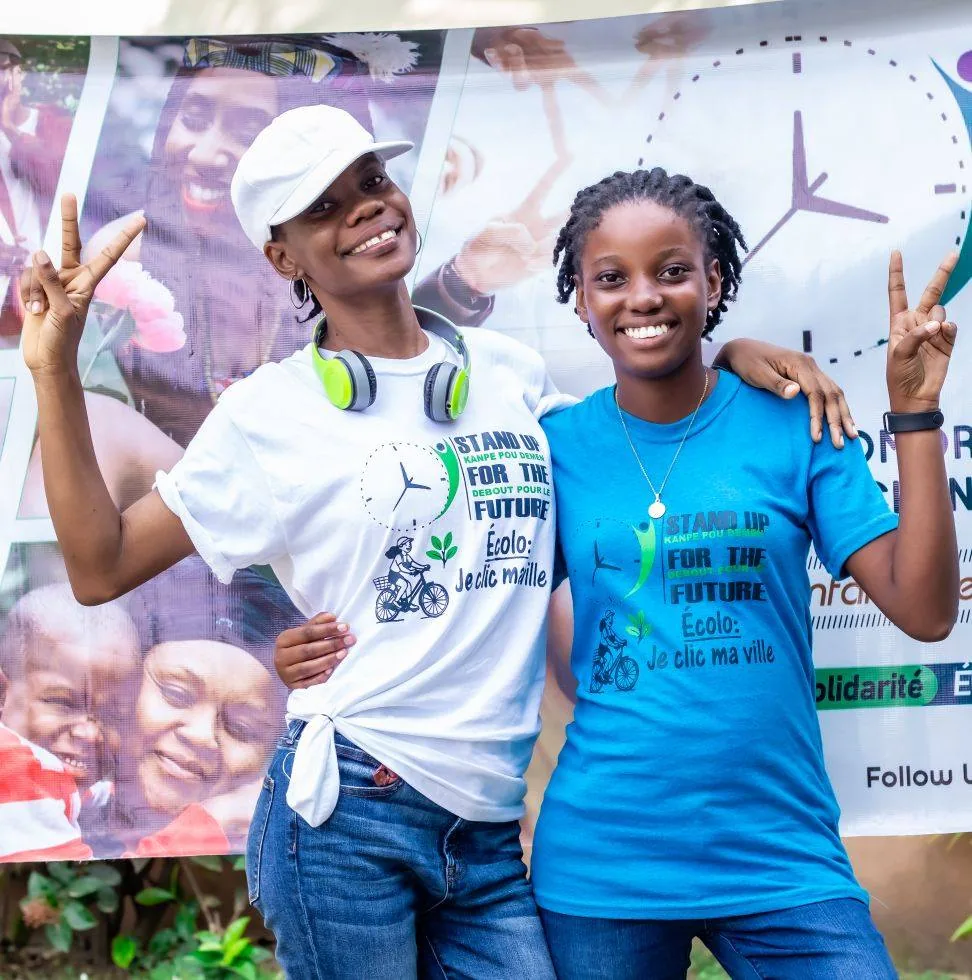 Stand Up youth wearing branded shirts at a community event